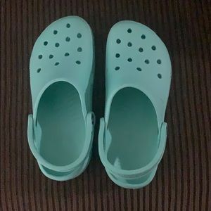 Mint green crocs